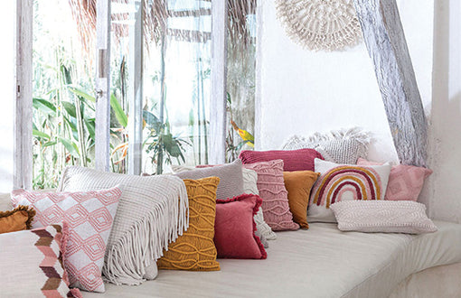 USING COLOURED CUSHIONS TO BRIGHTEN YOUR HOME