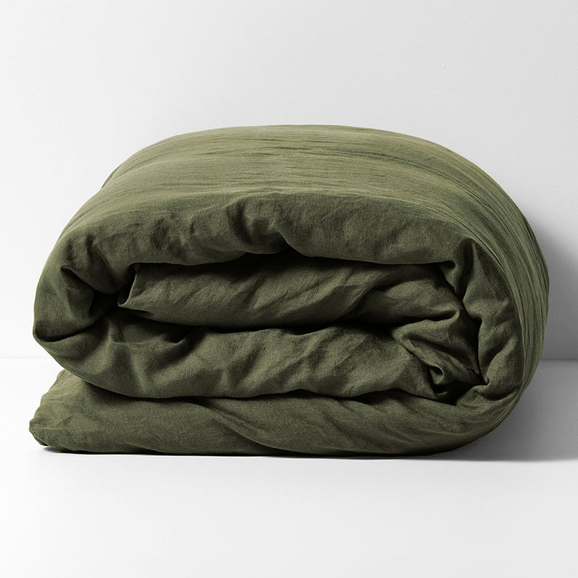 Emile linen quilt cover in Khaki styled on a bed