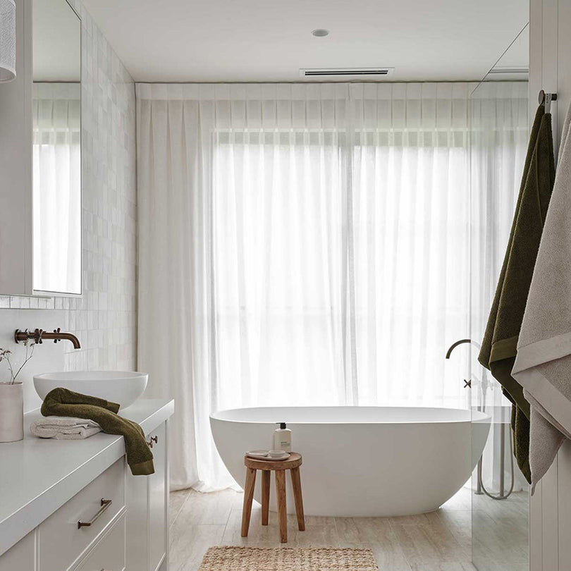 Aura Haven natural bath towels in a styled bathroom