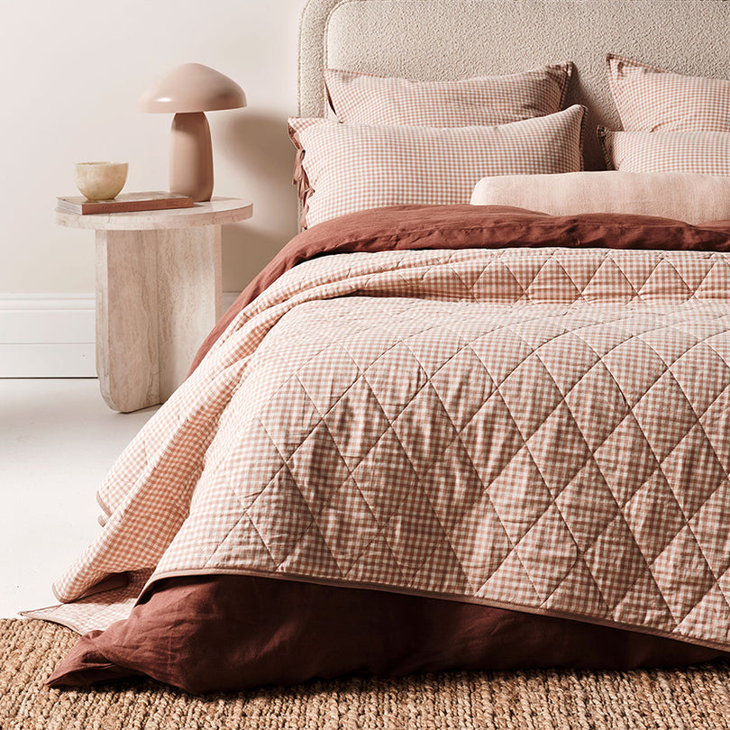 Clay gingham bedding in a warm sun-washed palette