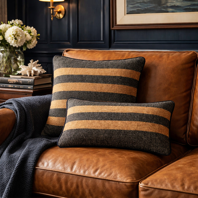Close-up detail of chocolate-toned cushions and homewares