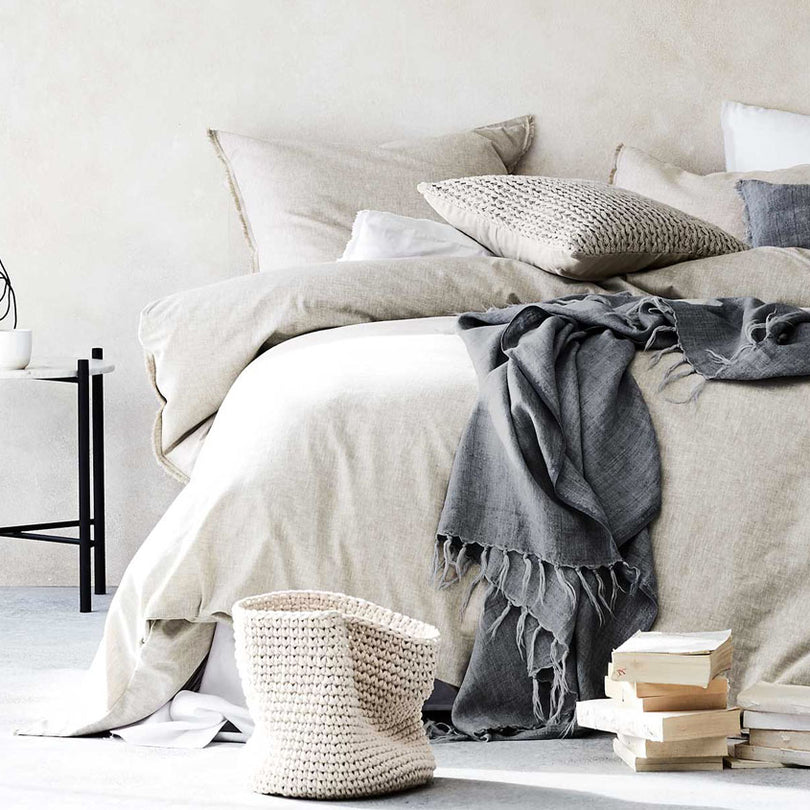 Queen bed styled with a King size quilt